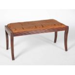 A Regency mahogany rectangular window stool, the drop in upholstered seat raised on four tapered