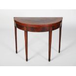 A 19th century mahogany and marquetry inlaid demi lune card table, the hinged top with a broad