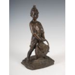 An early 20th century Continental bronze figure of a boy grape picker, modelled standing holding a