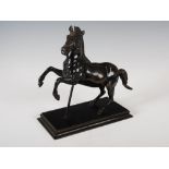 A late 19th century bronze figure of a rearing stallion, on a rectangular plinth base, 22.5cm high x