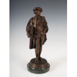 A late 19th century bronze figure of an Artist, modelled standing with a folio under his right arm