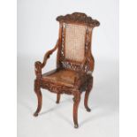 A Chinese dark wood armchair, with woven panel back and seat flanked by dragon carved arms, raised