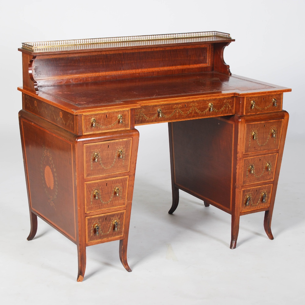 An Edwardian mahogany and satinwood banded pedestal desk by Edwards & Roberts, with raised gallery