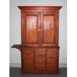 A Victorian pine Country House cupboard, the moulded cornice above a pair of cupboard doors