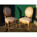 WITHDRAWN - A pair of late 19th century gilt wood parlour chairs, the foliate upholstered backs