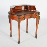 A late 19th/ early 20th century French kingwood and gilt metal mounted writing desk, the shaped