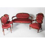 A late Victorian beech wood and gilt metal mounted parlour suite, comprising; sofa, armchair and