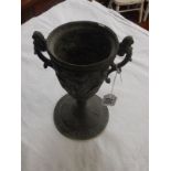 Old lead chalice with chased cherubs