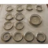 Set of 12 silver and glass coasters and bottle rest