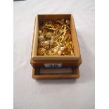 Wooden box of gold tone costume jewellery