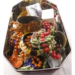 Tin of costume jewellery