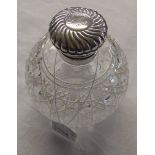 Silver topped perfume bottle