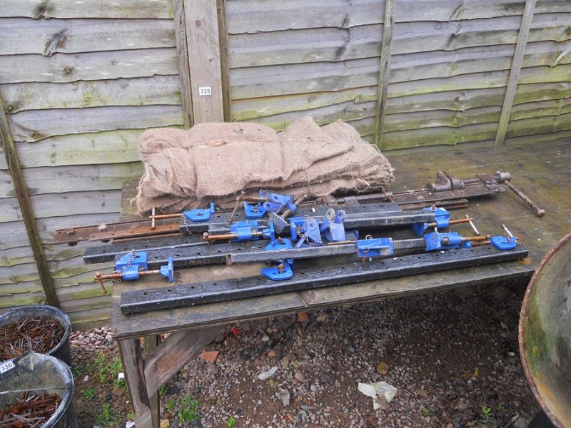 Large collection of sash clamps and sand bags