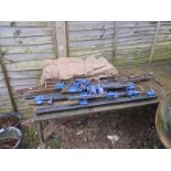 Large collection of sash clamps and sand bags
