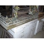 Ornate brass fire surround