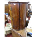 Georgian mahogany bow front corner cabinet