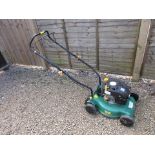 Working petrol rotary mower