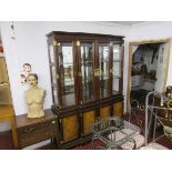 Large mahogany Oriental themed glass top cabinet