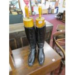 Pair of leather riding boots with wooden trunks