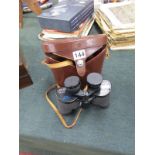 Set of binoculars with leather case