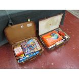 2 suitcases with old games