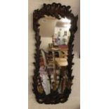 Ornate gilt framed wall mirror with treble sconces