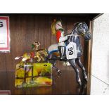 Tin plate soldier on horse back and cowboy clicker