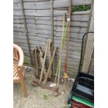 Collection of garden tools, pick axe etc