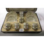 Boxed Aynsley coffee set with silver mounts on cups