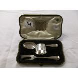 Hallmarked silver christening set comprising fork, spoon and napkin ring in fitted box