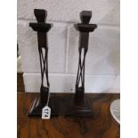 Pair of unusual rosewood candlesticks