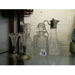 4 decanters, claret jug and pair of posy holders