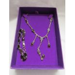 Silver and cabochon garnet set necklace and bracelet