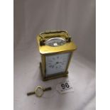 Small late 19C carriage clock in good working order with key