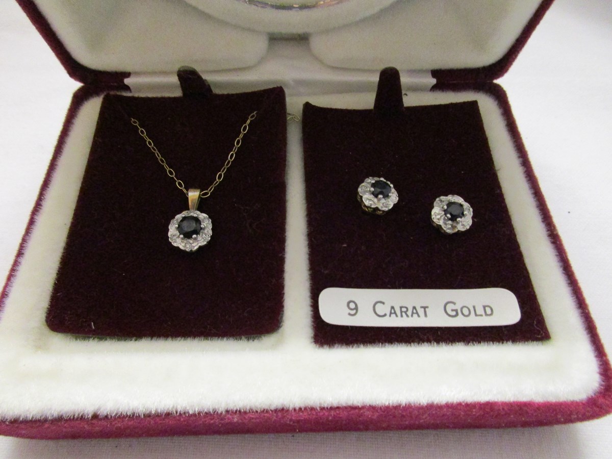 Gold diamond and sapphire earrings and pendant on chain