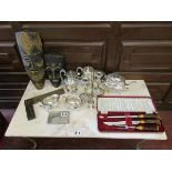 Selection of collectables to include masks, silver plate and carving set