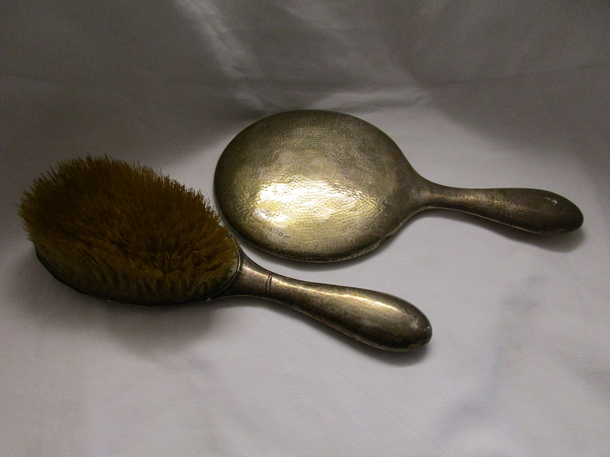 Silver mirror and silver brush