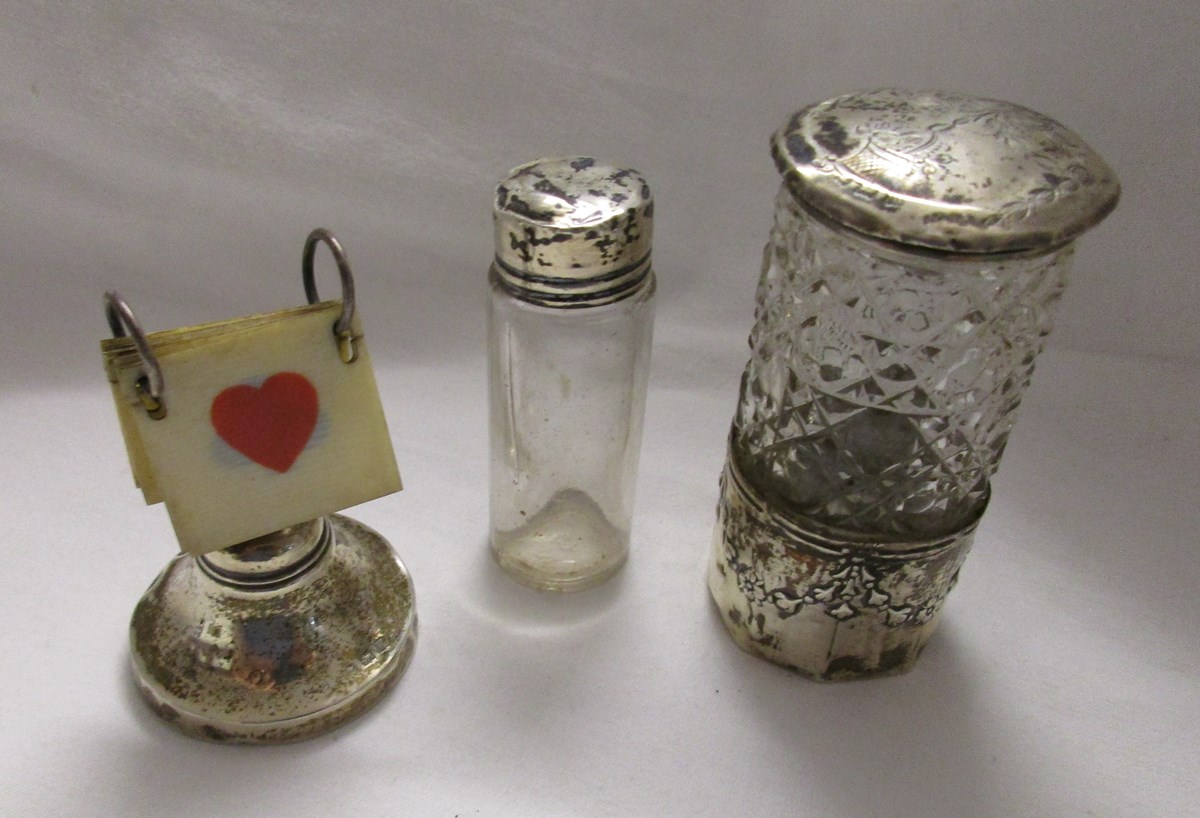 2 silver topped bottles and silver bridge suit marker