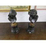 Pair of bronze busts on stands