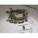 Heavy silver charm bracelet with enamel charms