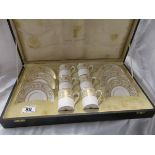 Cased Royal Doulton coffee cans and saucers