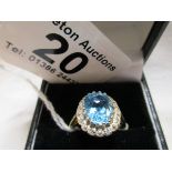 Gold and diamond ring set with blue stone