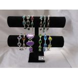 Collection of 12 stone set bracelets and display stand