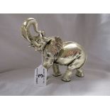 White metal (possibly silver) elephant