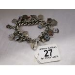 Heavy silver charm bracelet with enamel charms