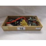Small box of costume jewellery to include silver & glass beads