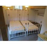 Pair of white metal framed single beds & mattresses