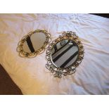 2 gilt 'curly' metal framed mirrors