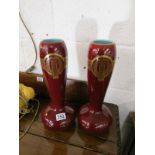 Pair of tall burgundy vases