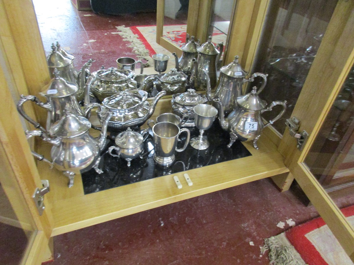 Shelf of silver plated tea & coffee pots etc